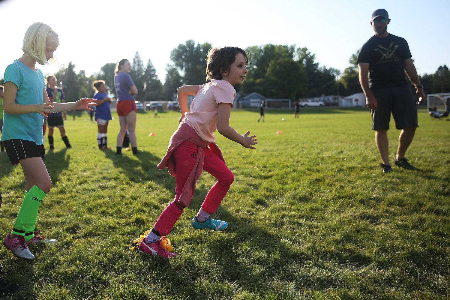 Hannah Gardner, 8, launches forward for her leg of the relay race
